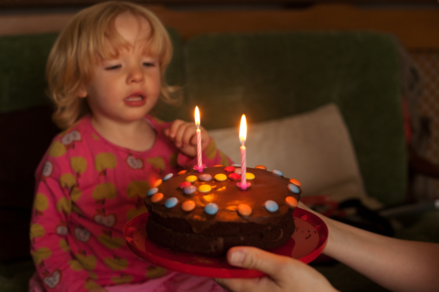 Emily hesitating in blowing out her candles - eventually Holly helped!
