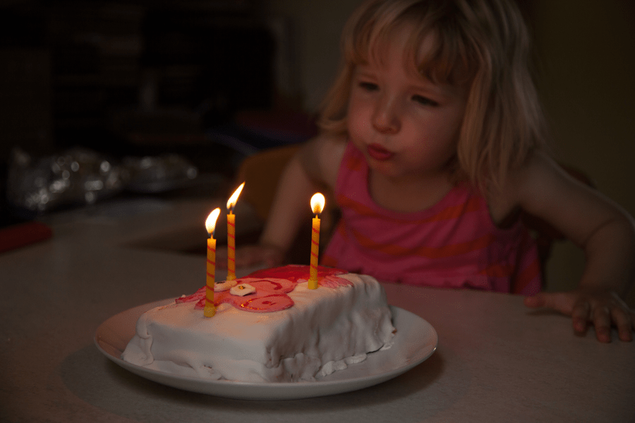 Blowing out her candles