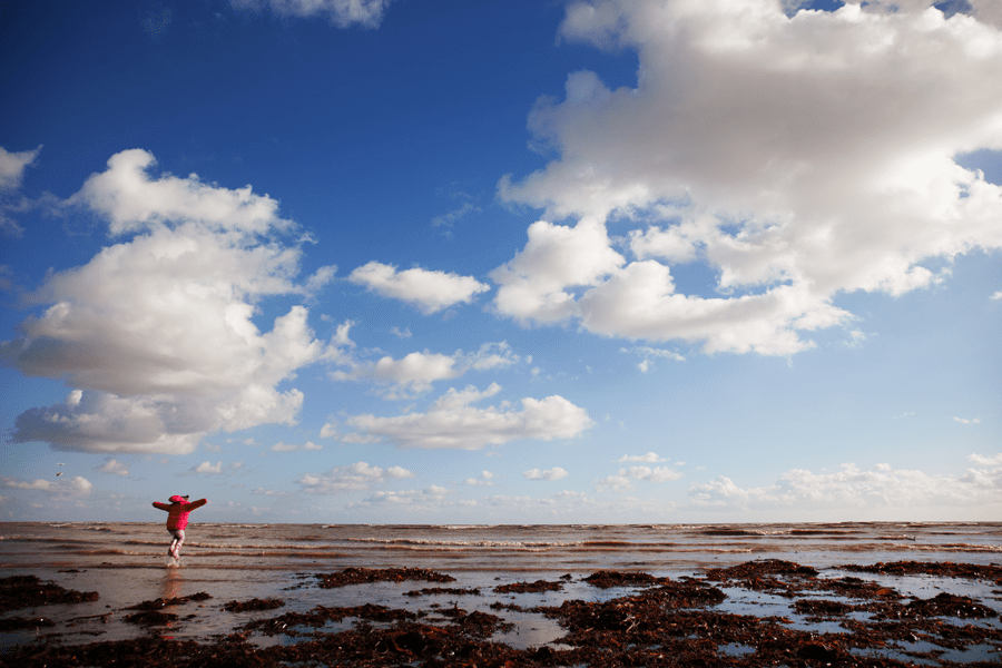 Holly jumping the waves