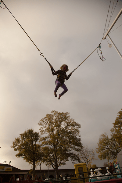 Rebekah jumping over a tree