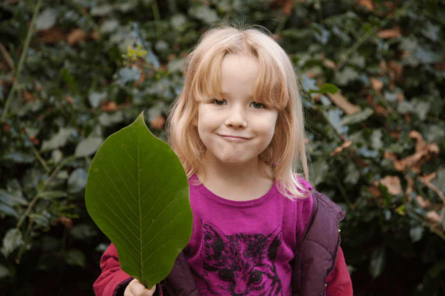 Emily with a giant leaf