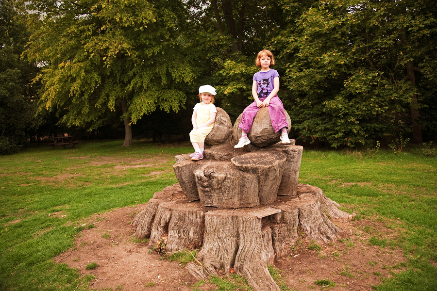 Sitting on the acorn sculpture